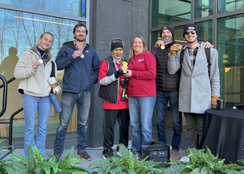 Colleagues stand together in winter coats, outside NCI-Shady Grove.