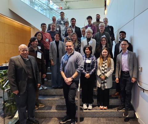 A group of HIRN attendees arranged on a set of stairs.