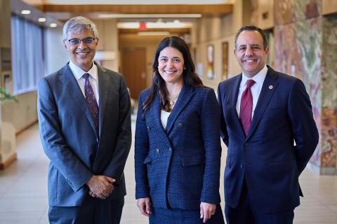 Bhattacharya, Rice, Harroz stand smiling together.