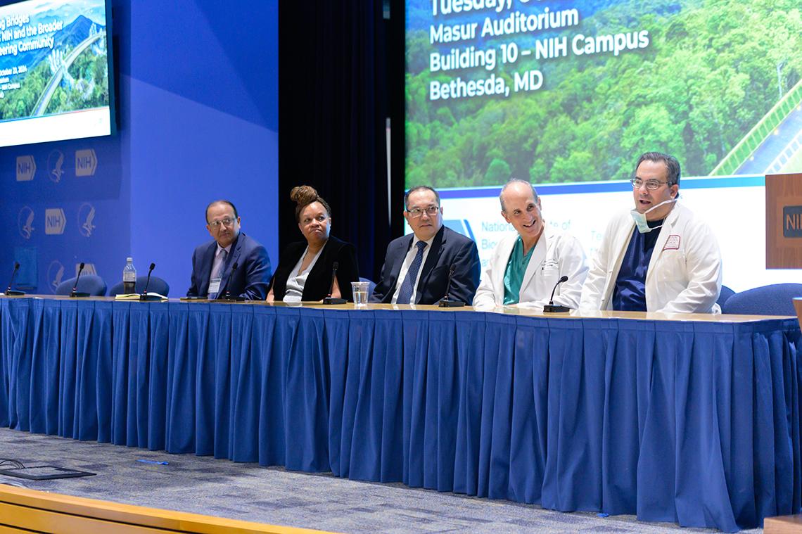 Five doctors sit on a panel