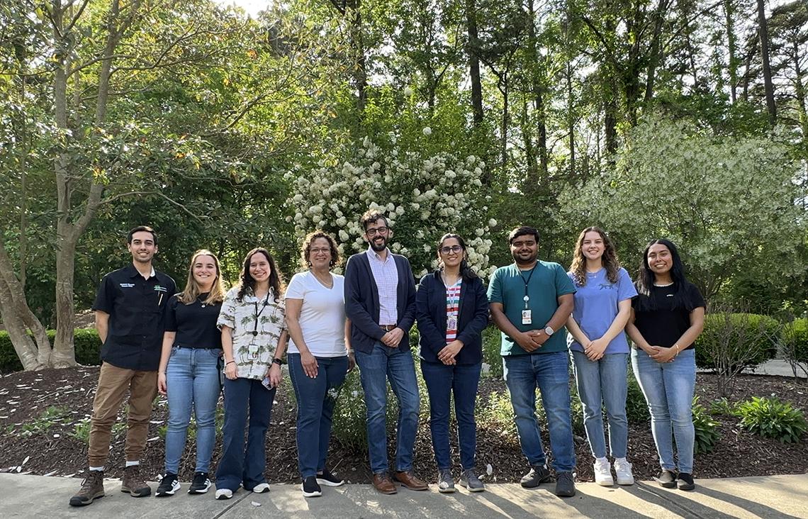 Group photo outside under trees