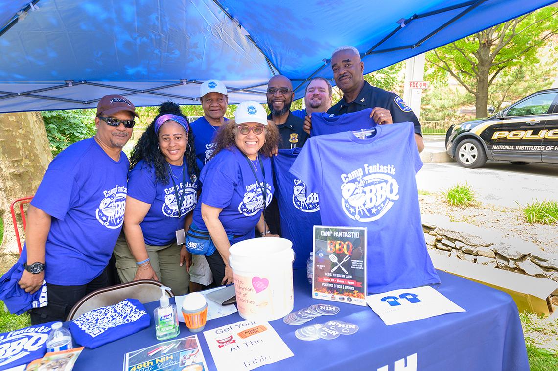A group photo featuring R&W staff and the NIH Police