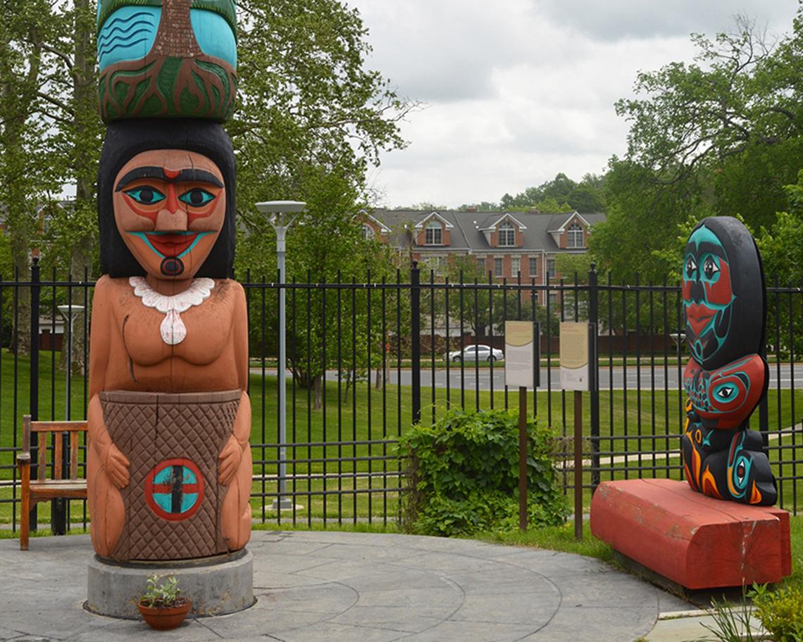 The colorful healing totem pole and carved bench outside NLM