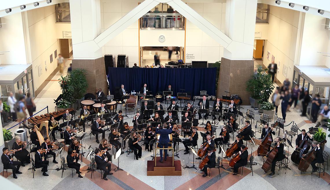 The full 60-piece orchestra in the CC atrium
