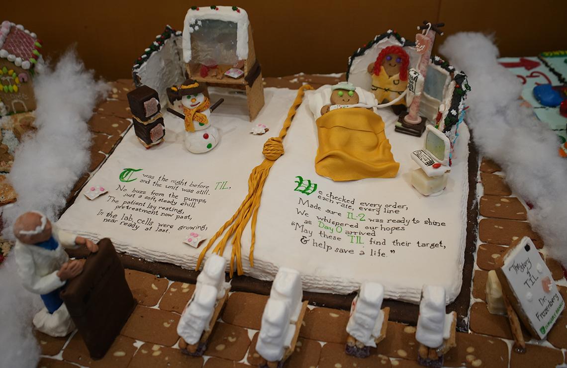 NCI's Dr. Steven Rosenberg at podium as patient gets immunotherapy infusion with writing on an open book