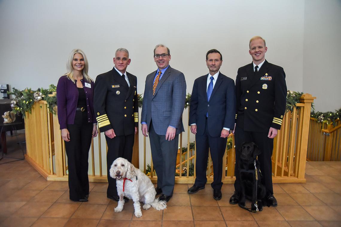 A group photo featuring Lucca, Christine, Letai, Sigounas, Johnson and Zilly the dog