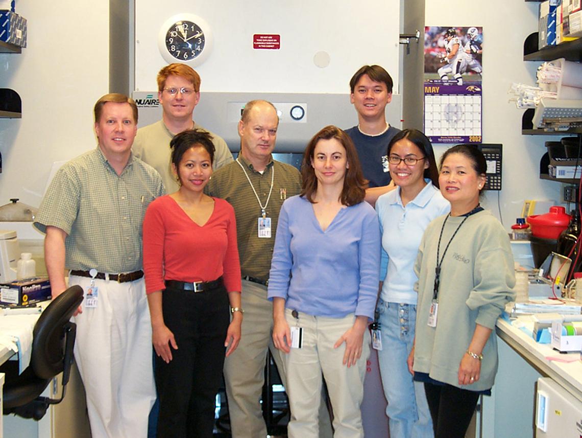 A 2002 photo of Whitehead with his lab mates first embarking on dengue vaccine research