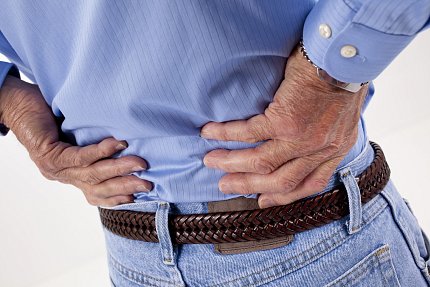 Mindfulness meditation A man holds his lower back