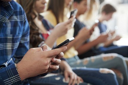 High Amounts of Screen Time Children using their phone