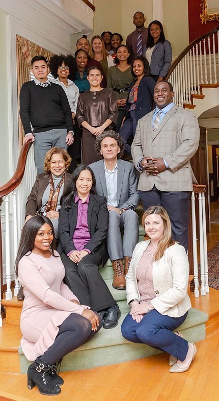 iCURE scholars, staff with NCI leadership Group of iCURE scholars and staff pose with NCI leadership on a winding staircase.