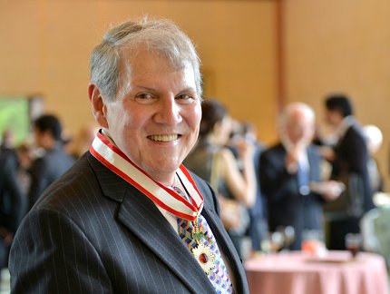Dr. Stephen Katz wears Rising Sun medal Katz wearing Rising Sun medal, with award reception in background
