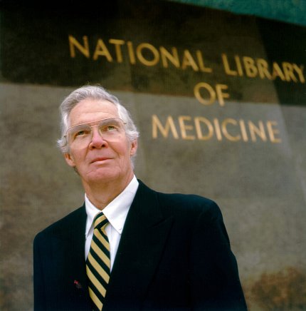 Dr. Lindberg Dr. Lindberg stands in front of NLM.